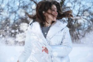 Smiling Women in a White Winter Coat